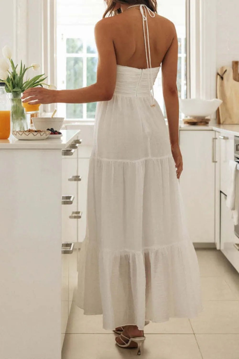 Maxi dress, back zipper, halter tied, v-neck, ruched, tiered, ruffled, partially lined, no stretch, back view