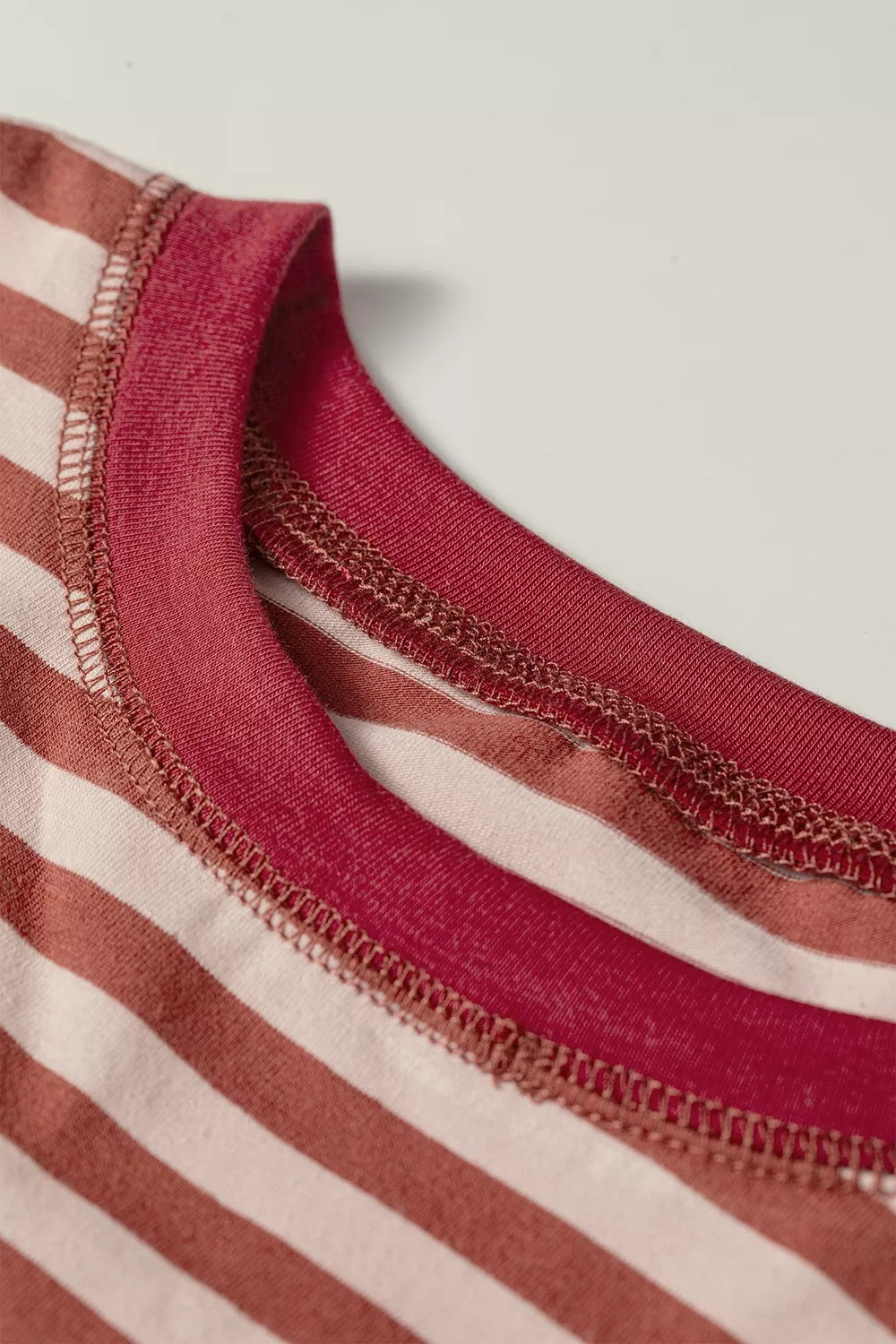 Say No More Short Set in cream and rust stripes with a long-sleeve drop-shoulder top and elastic-waist shorts, shown from a close up view.