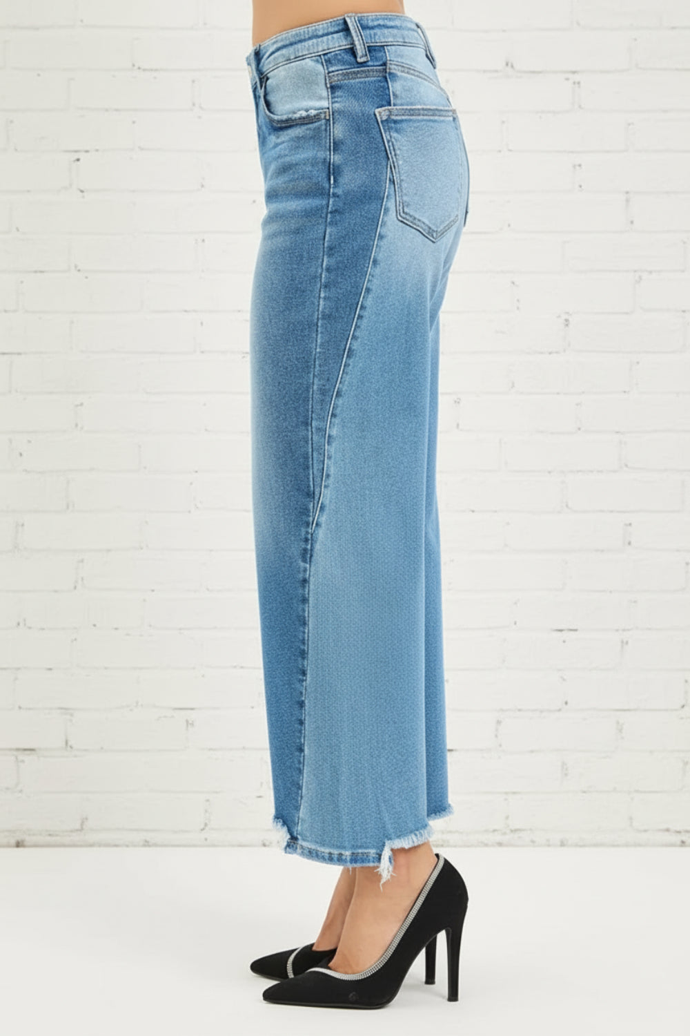 Risen Jeans, full-size, mid-rise, slouchy, cropped, barrel shape, dark combo, raw hem, belt loops, button/zipper closure, pocketed, slightly stretchy, side view