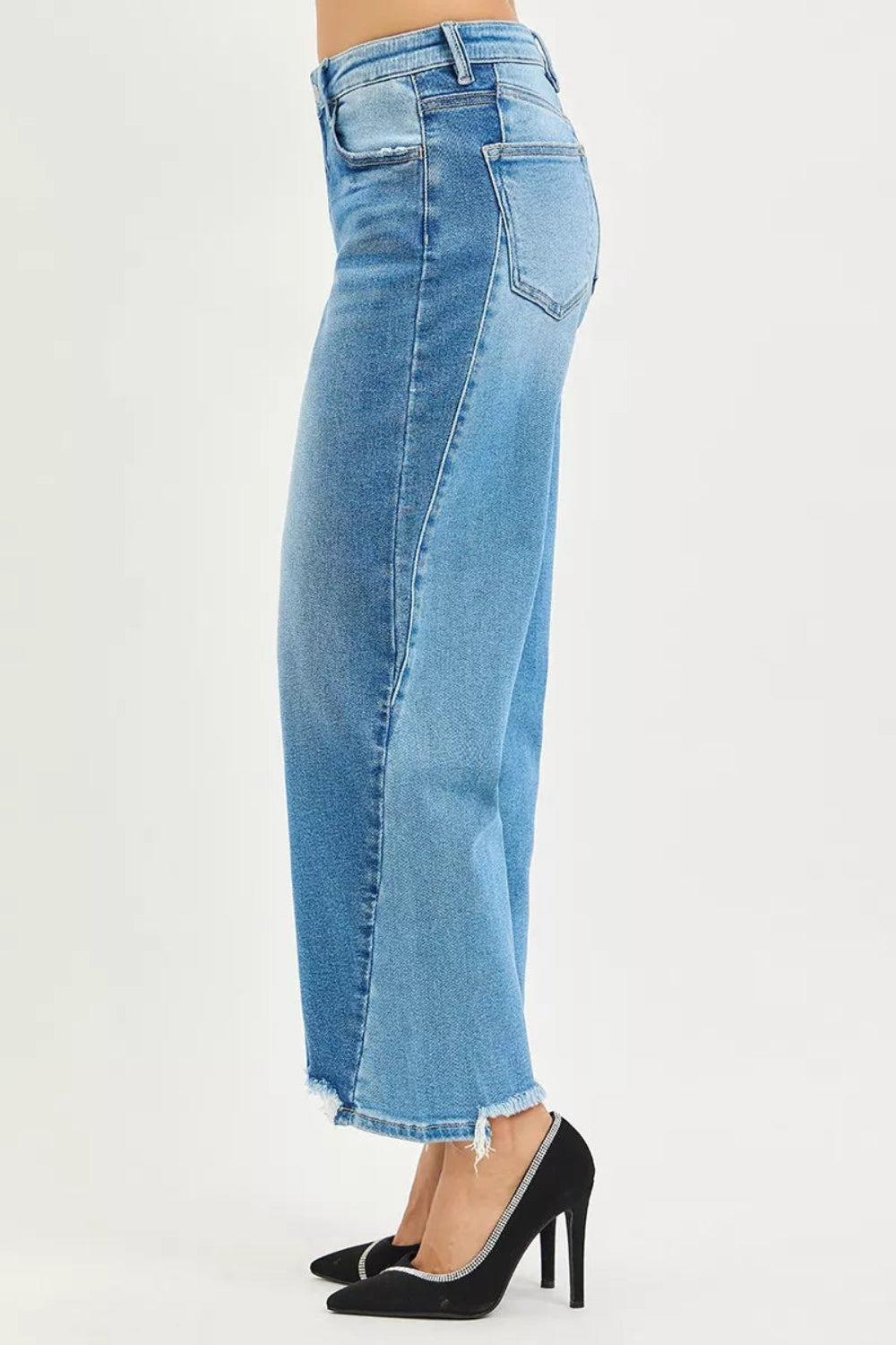 Risen Jeans, full-size, mid-rise, slouchy, cropped, barrel shape, dark combo, raw hem, belt loops, button/zipper closure, pocketed, slightly stretchy, side view