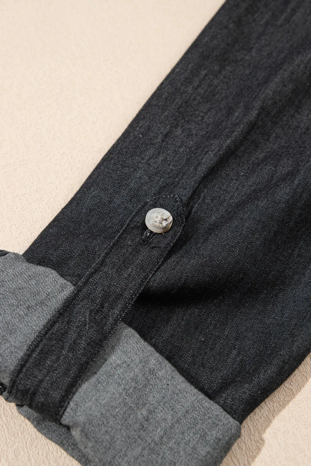 Denim shirt, long sleeve, collared, double front pockets, buttoned, cuffed, roll-tab sleeves no stretch close up view