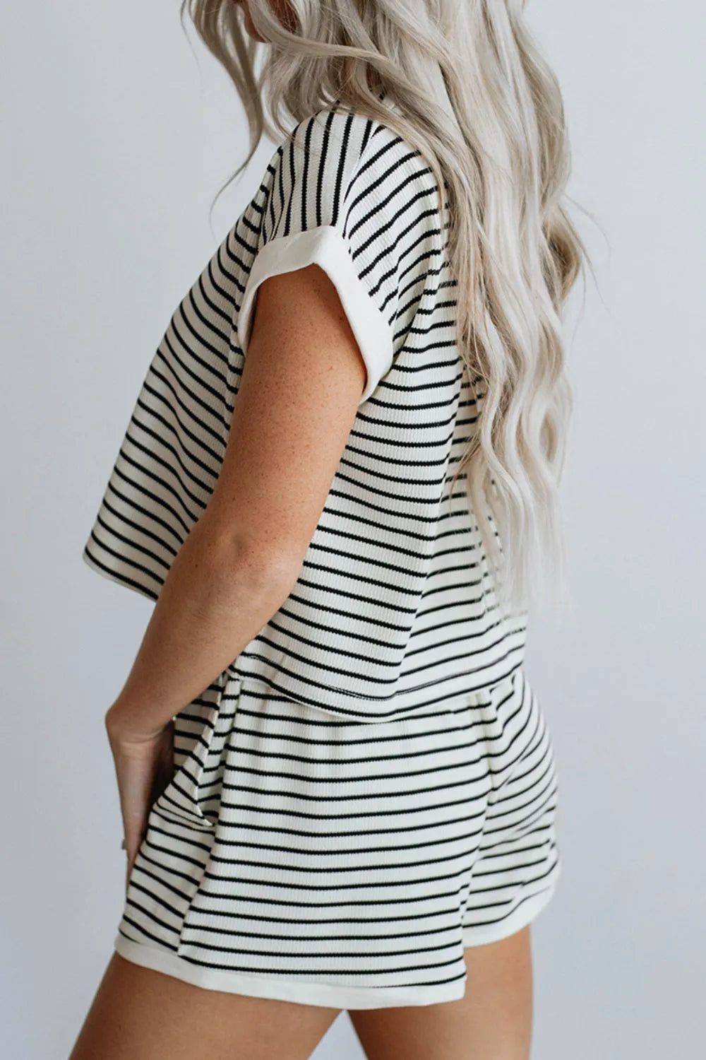 Two-piece short set, short sleeve, cuffed sleeve, cropped, striped pattern, contrast trim, elastic waist, pocketed, no drawstring, slightly stretchy side view