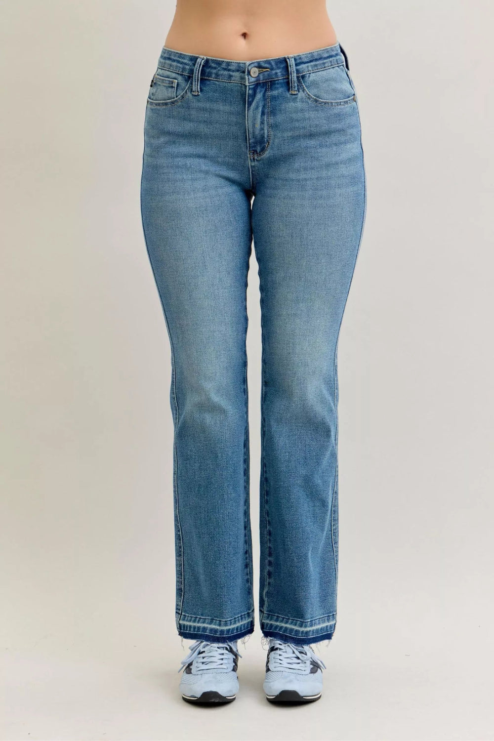 Judy Blue Jeans, full-size, mid-rise, medium wash, slim, bootcut, tummy control, release hem, pocketed, belt loops, button/zipper closure, raw hem, slightly stretchy, front view