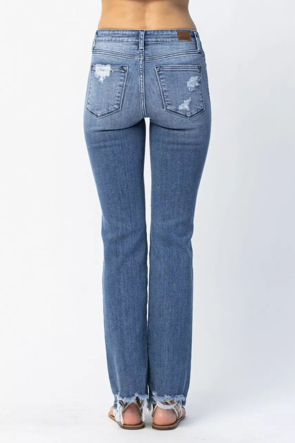 Judy Blue Jeans, full-size, mid-rise, distressed, raw hem, pocketed, belt loops, button/zipper closure, straight leg, medium wash, slightly stretchy, front view
