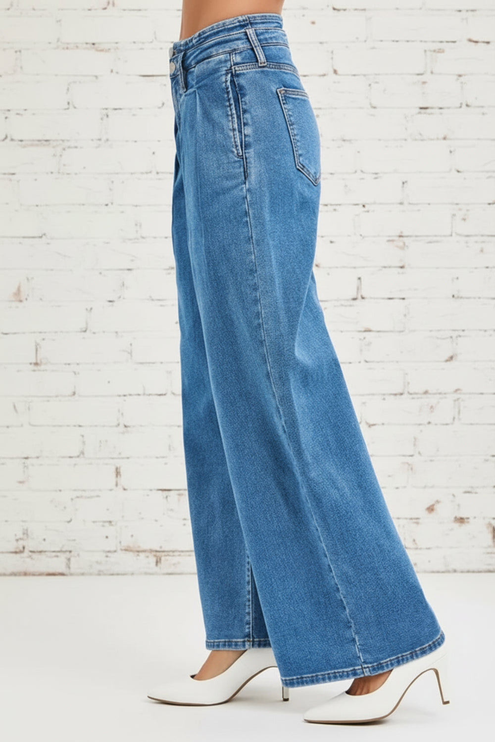Risen Jeans, full-size, mid-rise, pleated, wide leg, medium wash, pocketed, belt loops, double button/zipper closure, slightly stretchy, side view
