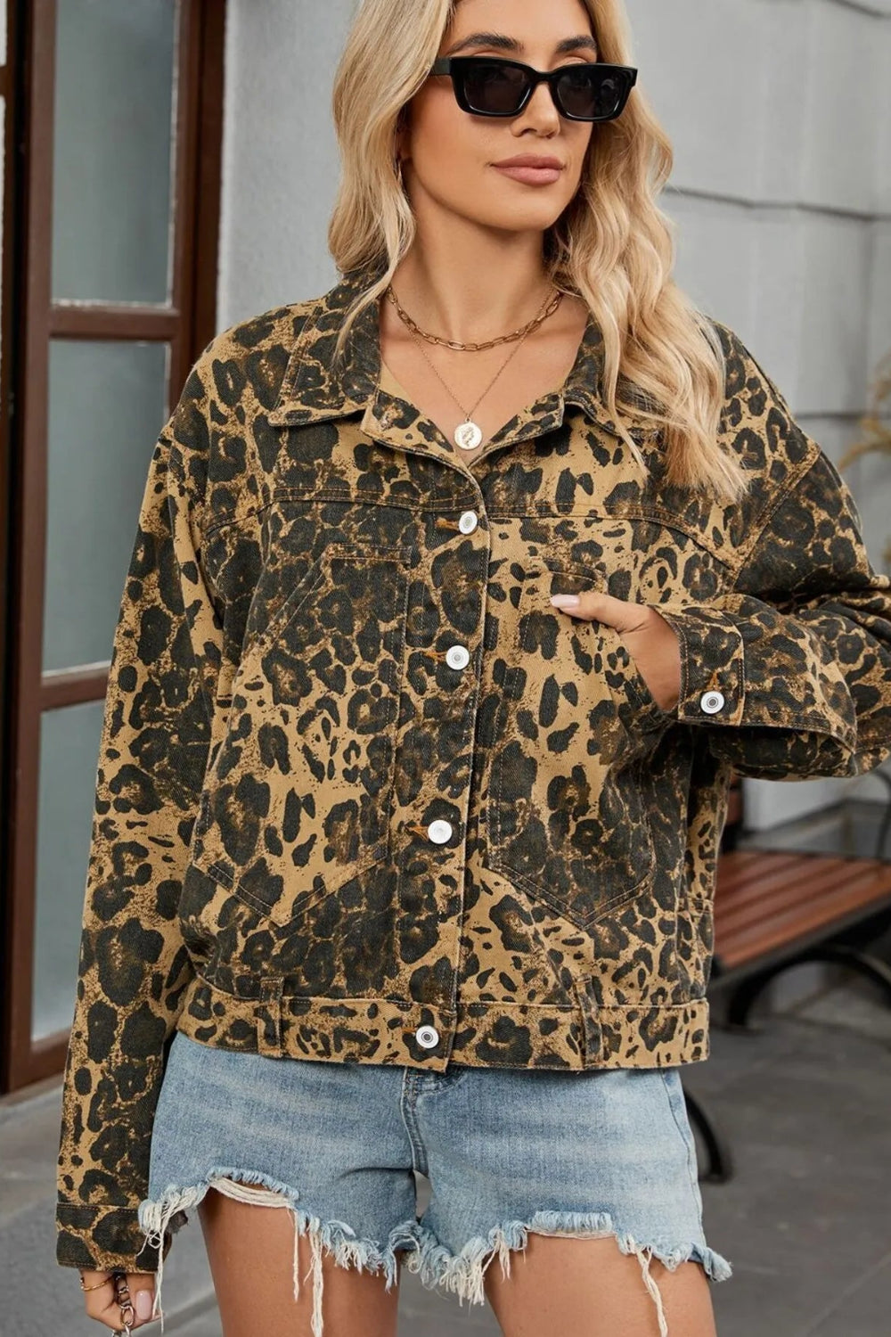 Denim jacket, leopard print, collared, pocketed, drop shoulder, buttoned, unlined, adjustable, no stretch front view