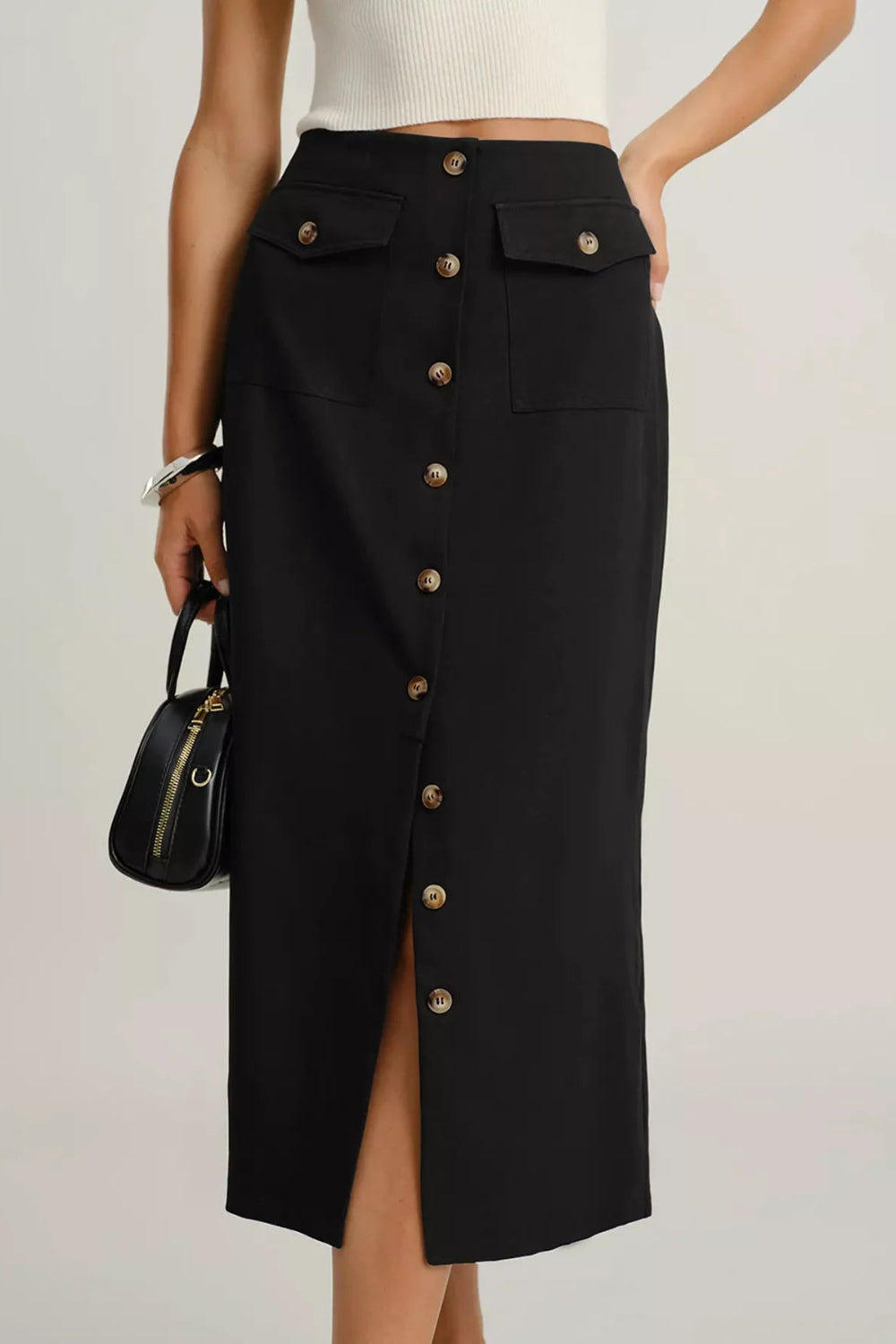 Midi-skirt, buttoned, front patch pockets, back zipper, unlined, some stretch, front view
