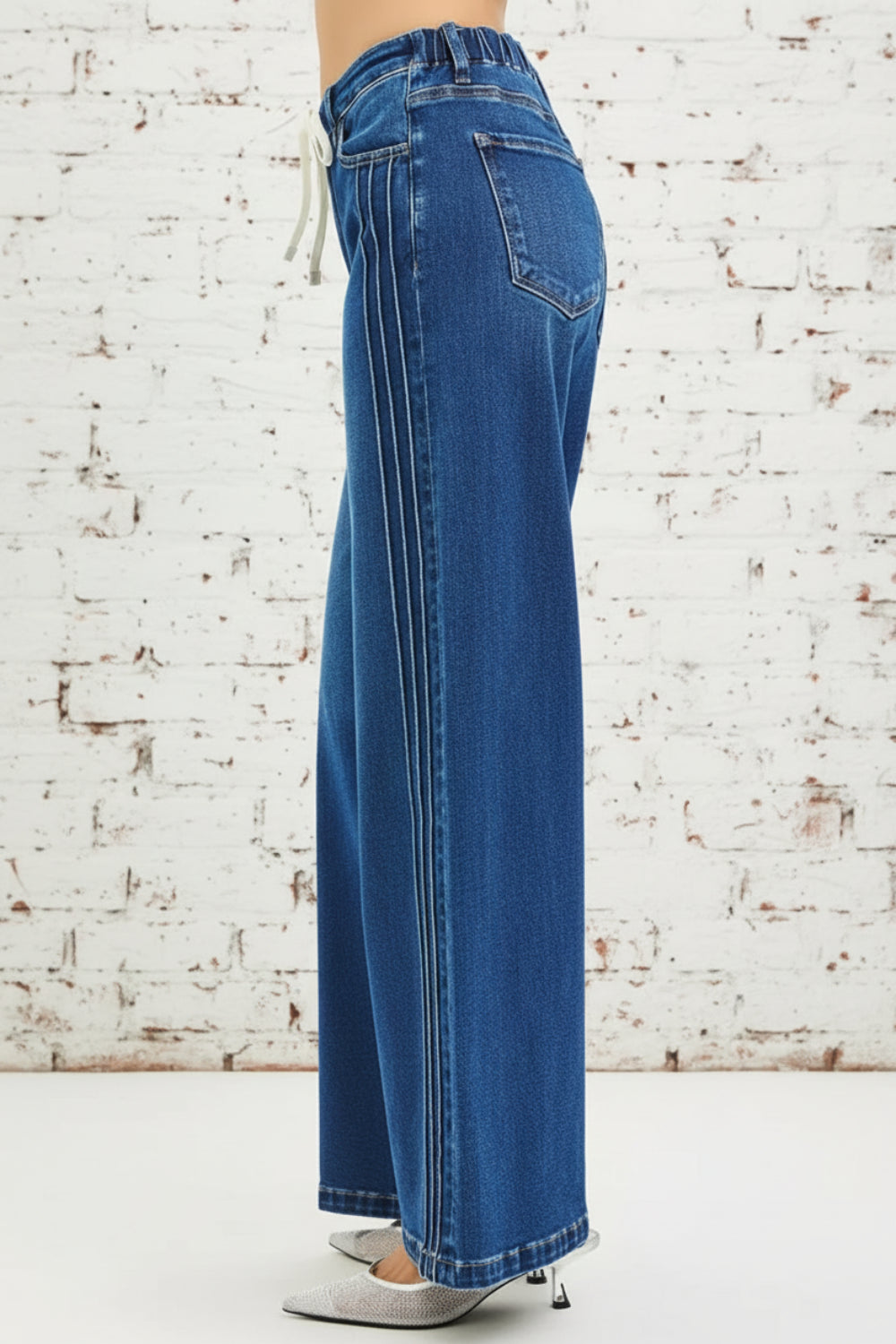 Risen Jeans, full-size, mid-rise, side pin tuck, wide leg, belt loops, elastic waist in back, drawstring closure, pocketed, dark wash, slightly stretchy, side view
