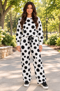 Point Taken Pant Set In Black with an ivory-and-black polka-dot sweatshirt and matching wide-leg drawstring pants front view.