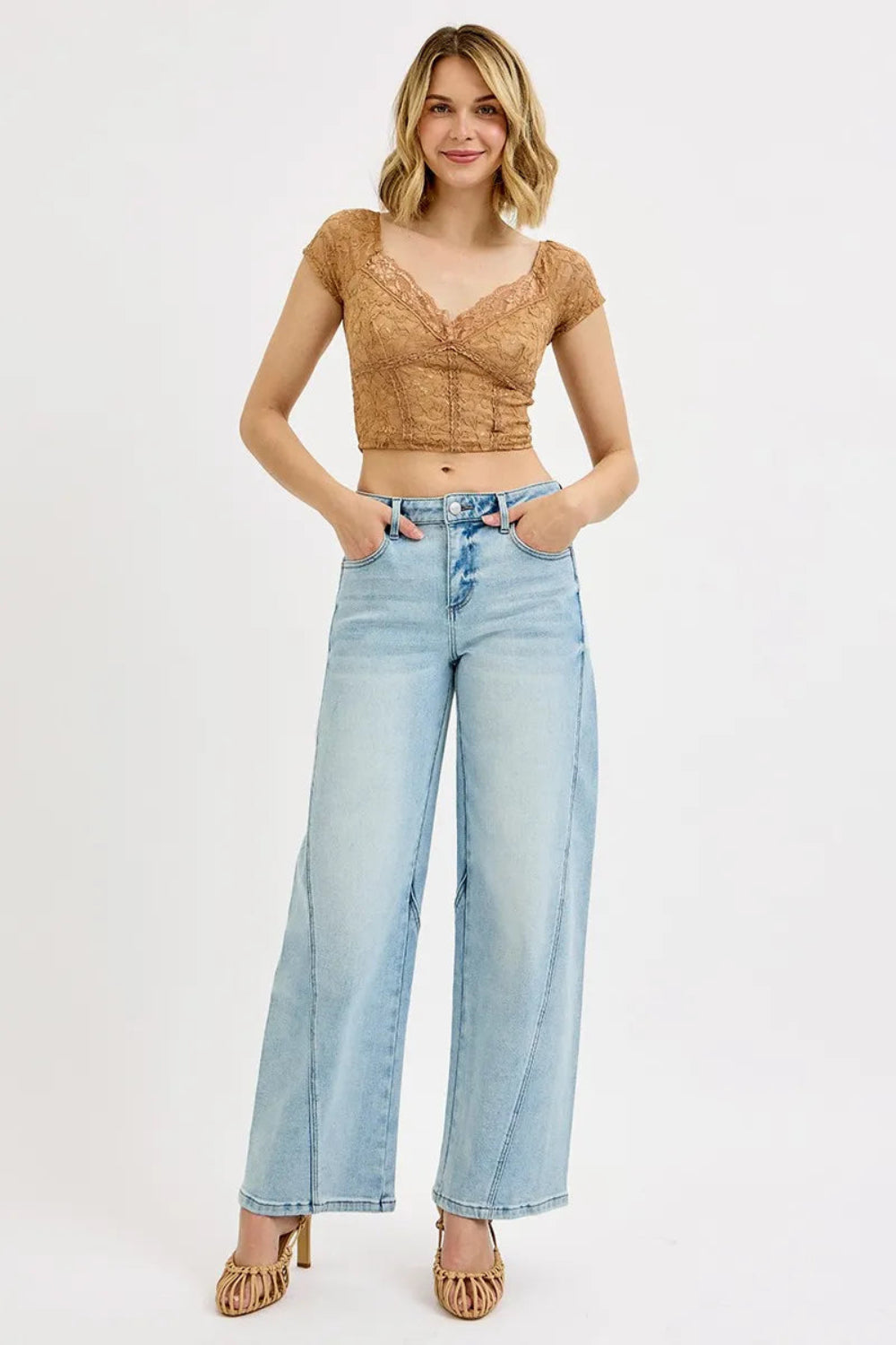 Risen blue jeans, full-size mid-rise, barrel fit, 5-pocket detail, button-zipper closure, belt looped, light wash, slightly stretchy, front view