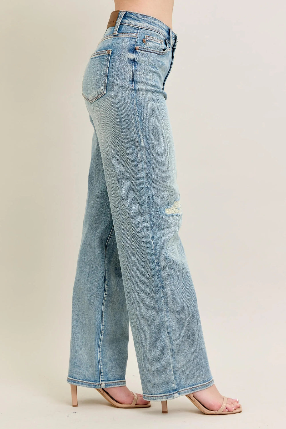 Judy Blue Jeans, full-size, high-rise, destroyed knee patch, distressed, pocketed, button and zipper closure, light wash, slightly stretchy, side view

