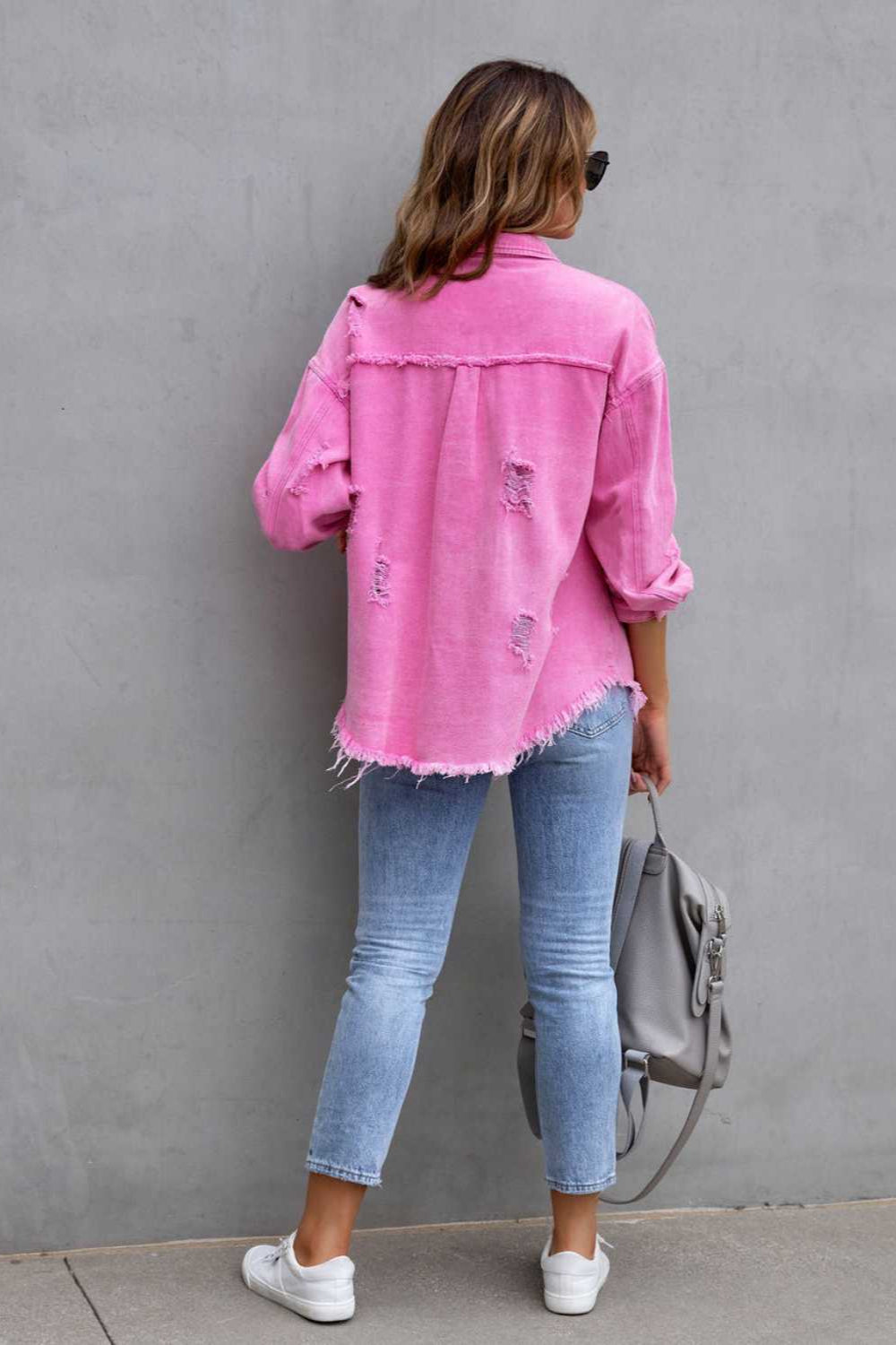 denim jacket, long sleeve, collared, buttoned, buttoned front patch pockets, distressed, fringed/raw hem, no stretch, multiple colors, back view