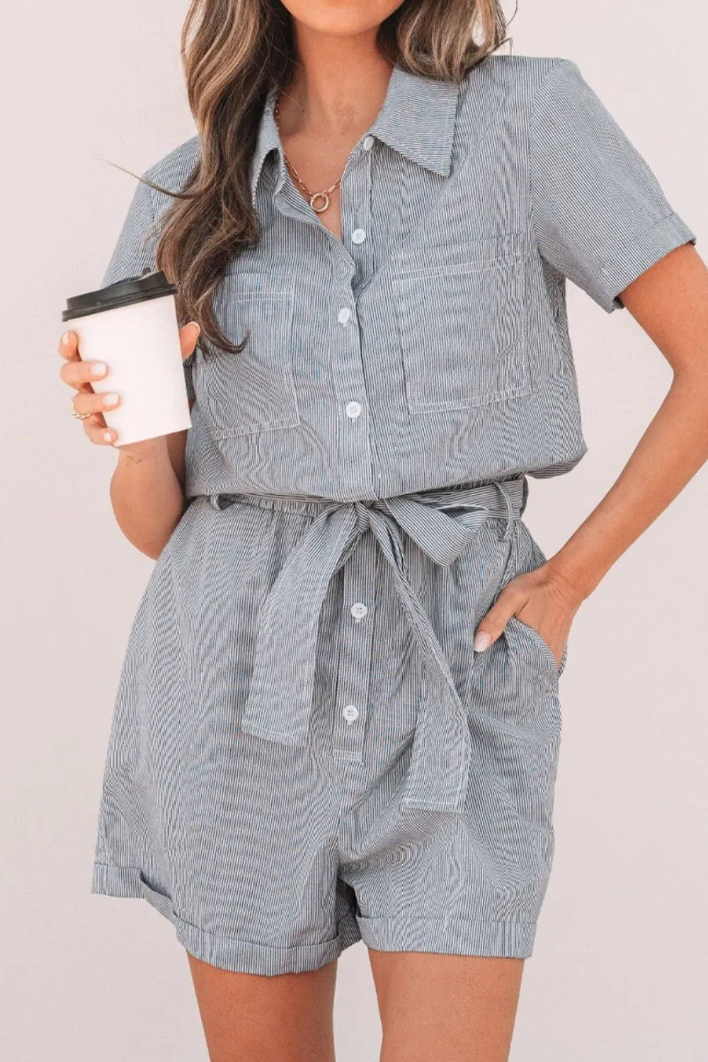 Romper, collared, short sleeve, cuff sleeve, buttoned, belted, opaque, pleated, elastic waist, no stretch front view