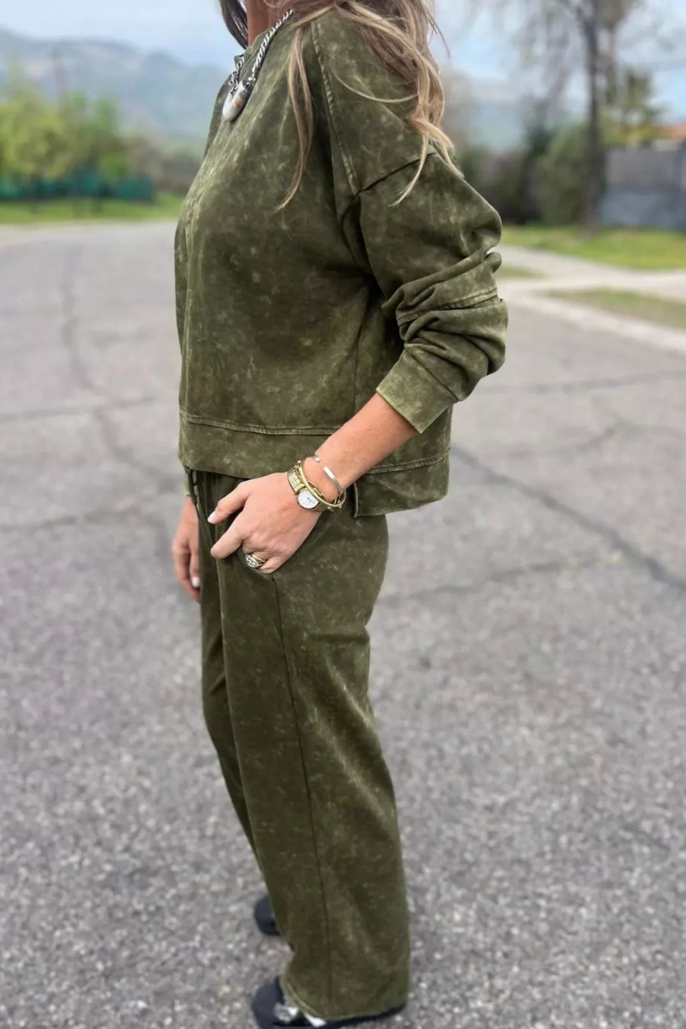 Two-piece pant set, pullover, long sleeve, drop shoulder, round neck, exposed seam,  side slit, elastic waist, drawstring, pocketed, stretchy, side view