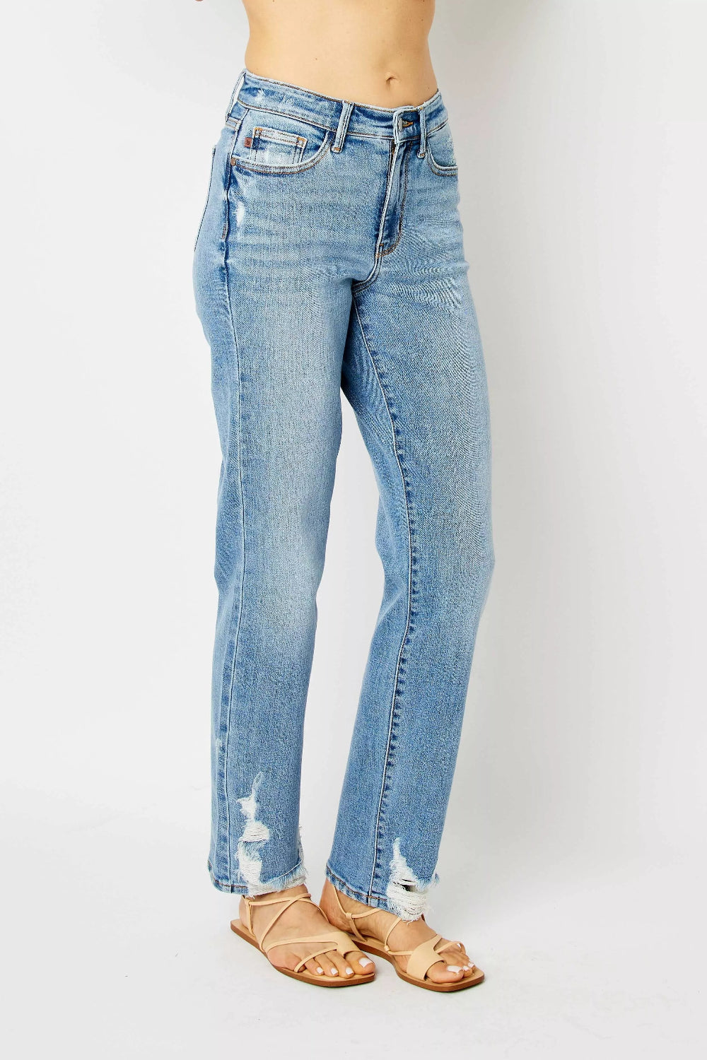 Judy Blue Jeans, full-size, high-rise, pocketed, belt loops, button/zipper closure, medium wash, straight leg, destroyed, raw hem, slightly stretchy, side view