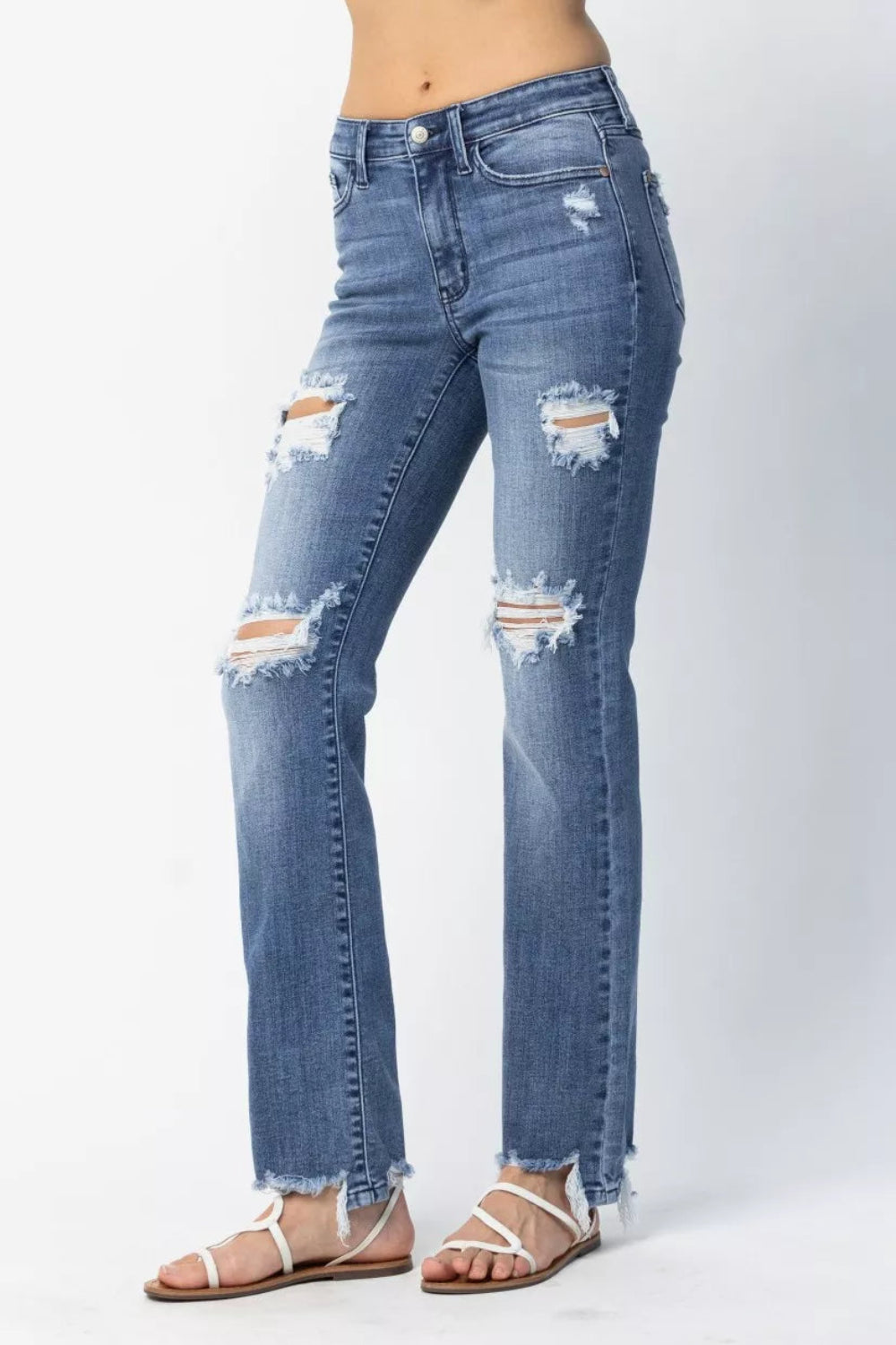 Judy Blue Jeans, full-size, mid-rise, distressed, raw hem, pocketed, belt loops, button/zipper closure, straight leg, medium wash, slightly stretchy, side view