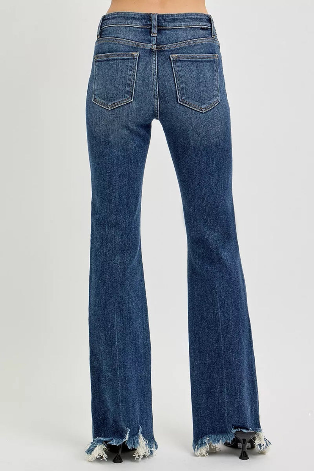 Risen Jeans, full-size, mid-rise, frayed hem, flared leg, dar wash, pocketed, belt loops, button/zipper closure, slightly stretchy, back view