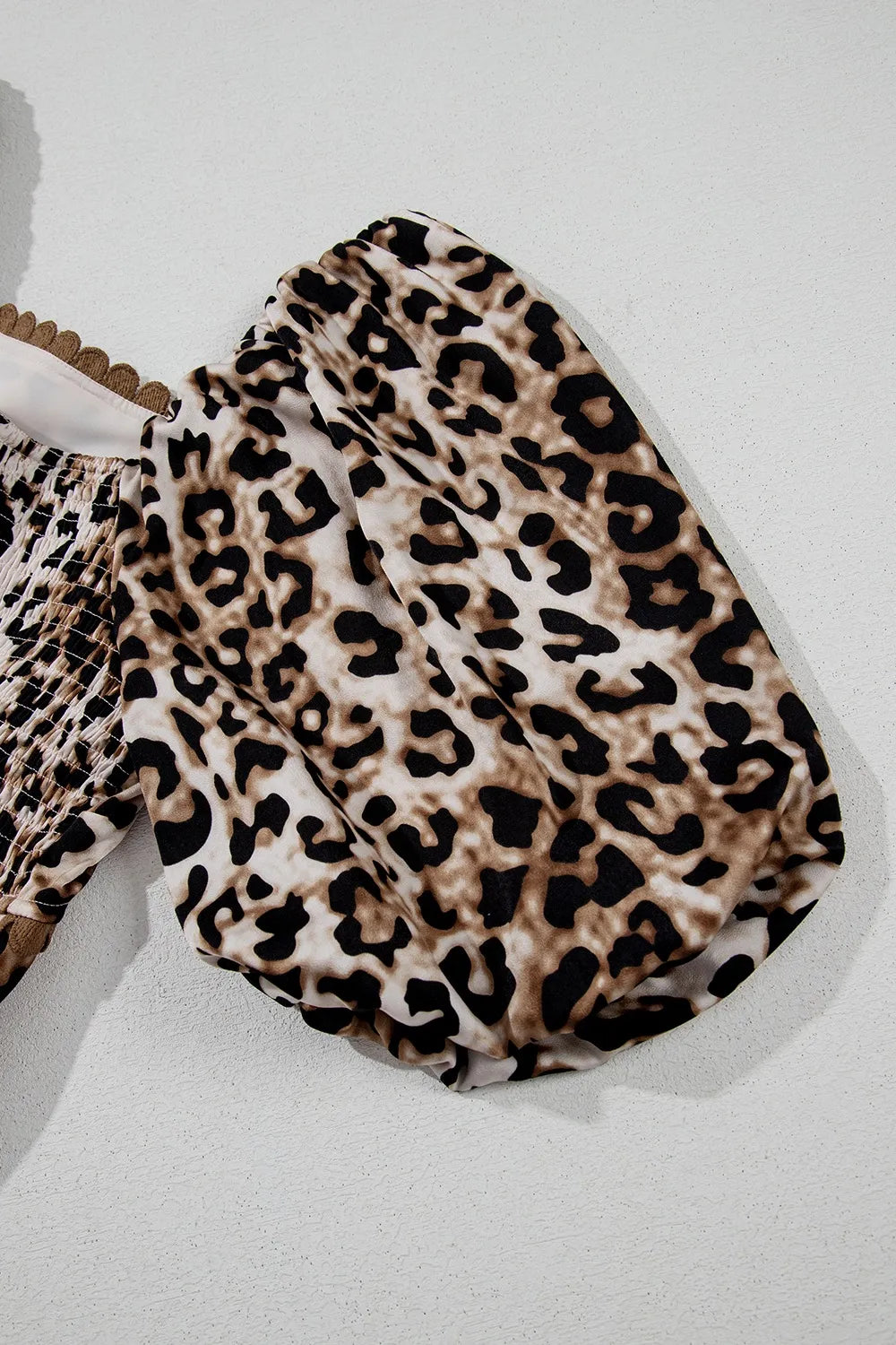 Tiered, pleated ruffled, pocketed, short puff sleeve, off shoulder leopard print, scalloped trim, square neck, unlined, opaque, slightly stretchy, maxi dress close up view