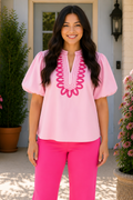 * Notched neck
* Buttoned
* Short puff sleeves
* Embroidered
* Slightly stretchy 