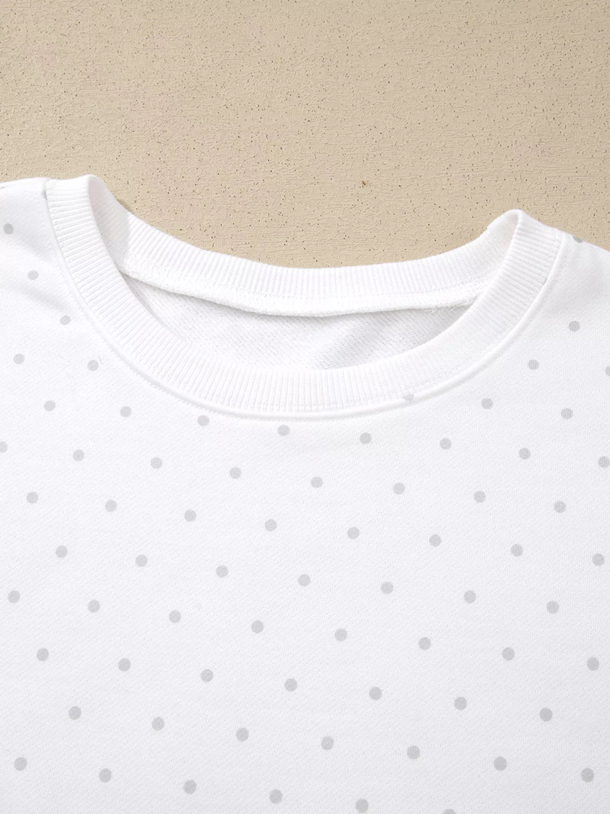 Cozy Dream Short Set in ivory with gray polka dots, a long-sleeve striped top, and matching ruffle-trim shorts close up view.