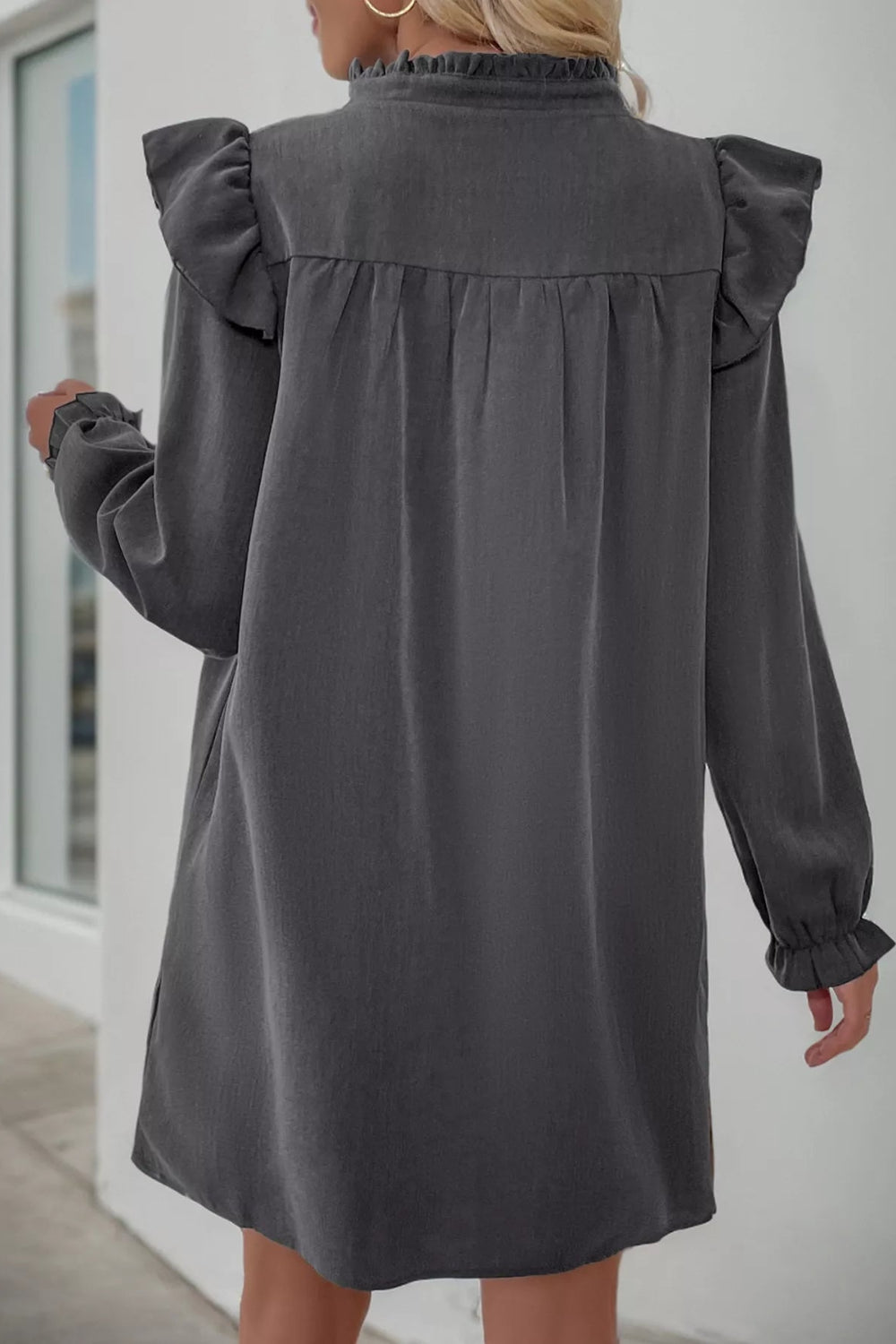 Mini dress, long sleeve, ruffled, v-neck, baby doll design, pullover, unlined, side slit, no stretch, back view