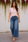 * Medium wash
* Front patch pockets
* Wide-leg
* High-rise
* Ankle length
* Pocketed
* Button/zipper closure
* Belt loops
* Distressed hem
* Slightly stretchy