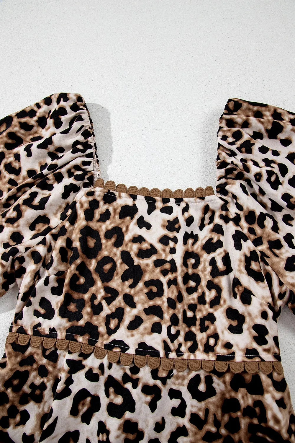 Tiered, pleated ruffled, pocketed, short puff sleeve, off shoulder leopard print, scalloped trim, square neck, unlined, opaque, slightly stretchy, maxi dress close up view