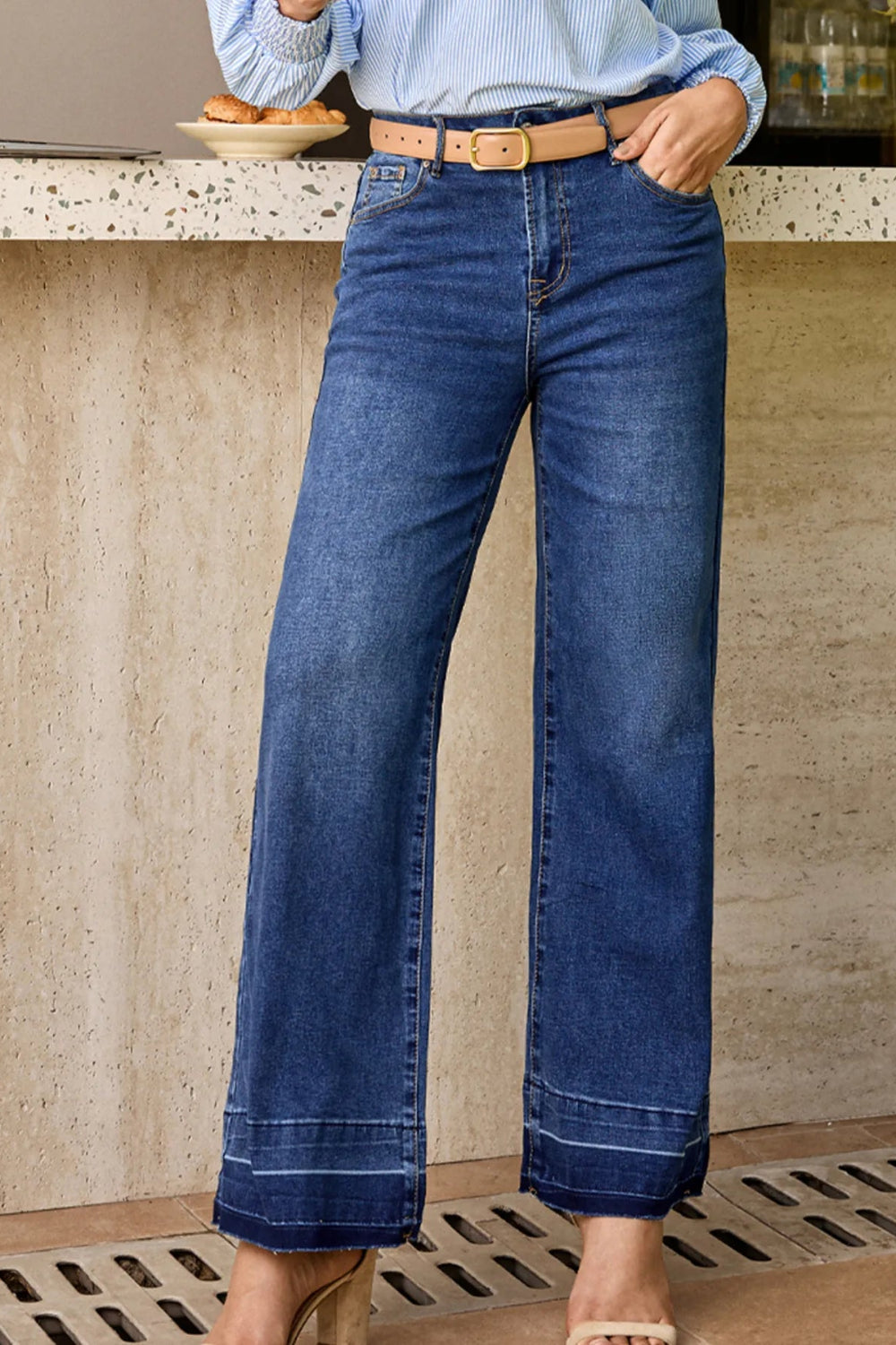 Jeans, high-rise, drop hem, raw hem, straight leg, pocketed, belt loops, button/zipper closure, vintage wash, some stretch, front view
