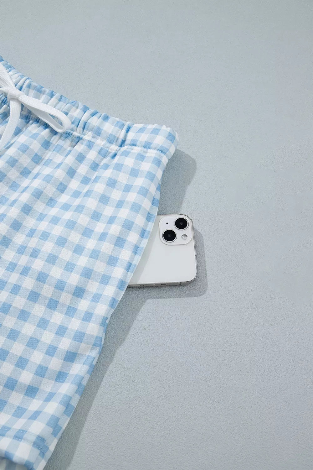 Since You Asked Short Set in light blue and white gingham with a long-sleeve top, white ribbed trim, and matching shorts.
