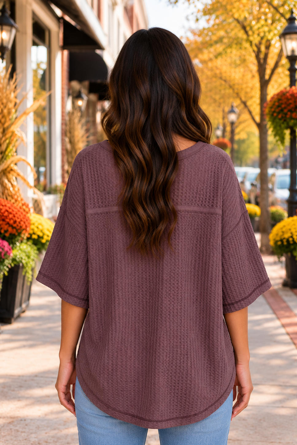 Back view of the One Fine Day Top in maroon with a textured knit, V-neckline, relaxed shape, and three-quarter bell sleeves.