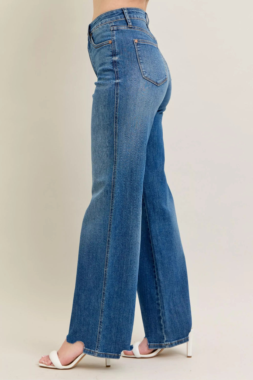 Judy Blue Jeans, full-size, high-rise, tummy control, medium wash, belt loops, button/zipper closure, pocketed, destroyed, chewed hem, wide leg, slightly stretchy, side view