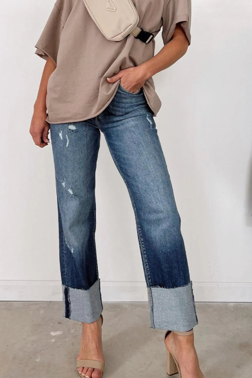 Jeans, straight leg, high-rise, distressed, pocketed, belt loops, raw hem, double button/zipper closure, slightly stretchy, front view