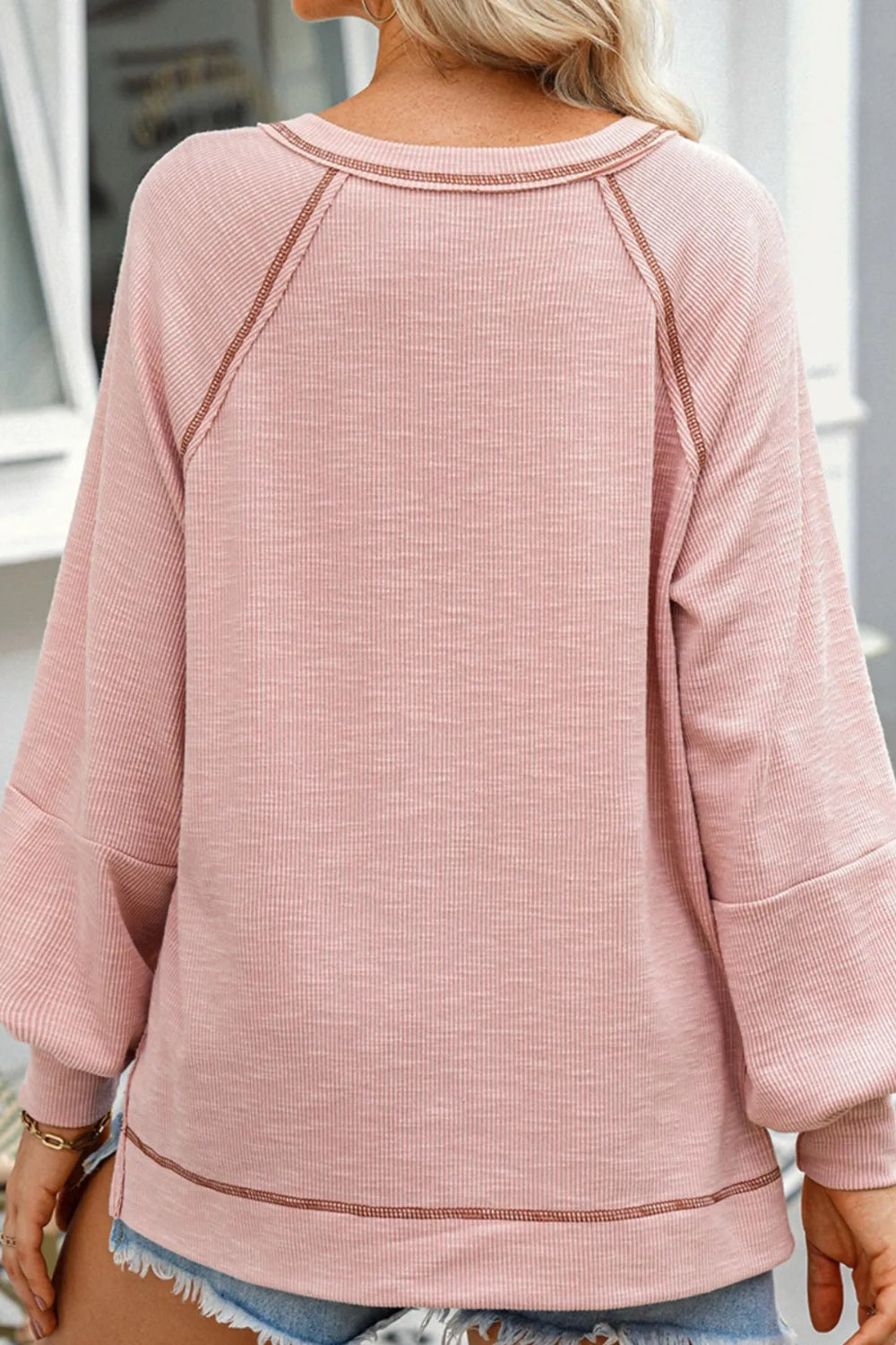 Top, pullover, long sleeve, v-neck, drop shoulder, exposed seam, ribbed-knit, oversized, slightly stretchy, back view