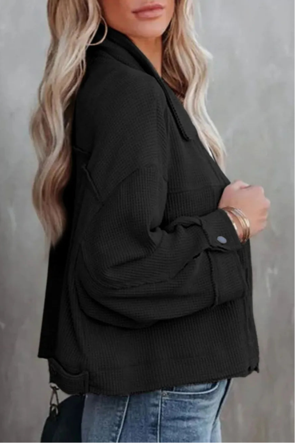 Jacket, collared, oversized, distressed, pleated, drop shoulder, buttoned, pocketed, long sleeve, waffle-knit, exposed seam, sits at the waist, pleated, adjustable straps, some stretch side view