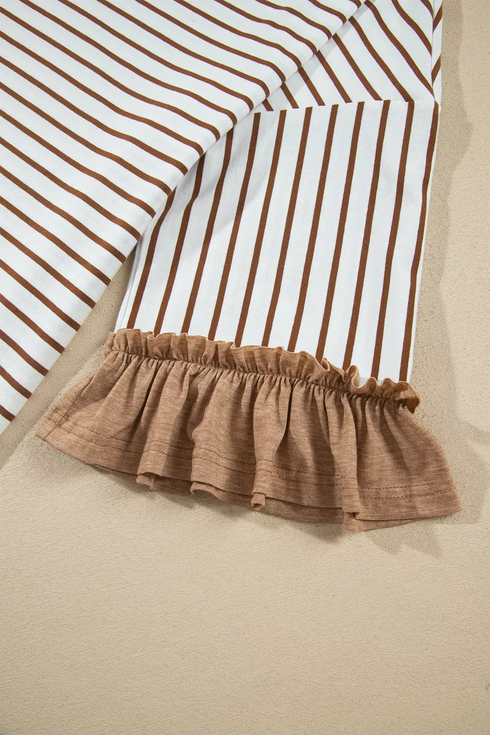 * Two-piece pant set
* Striped
* V-neck
* Long sleeve
* Drop shoulder
* Ruffled cuffs
* Side slit
* Elastic waist
* Drawstring
* Pocketed
* Ruffled
* Contrast trim
* Moderate stretch