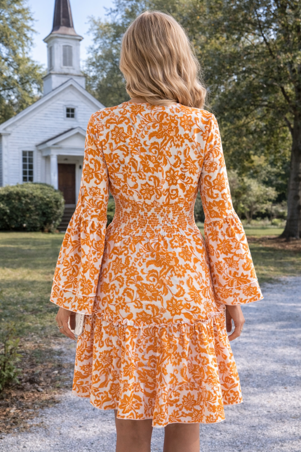 * Midi Dress
* Smocked
* Long flared sleeve
* V-neck
* Tiered
* Ruffle hem
* Unlined
* Slightly stretchy
