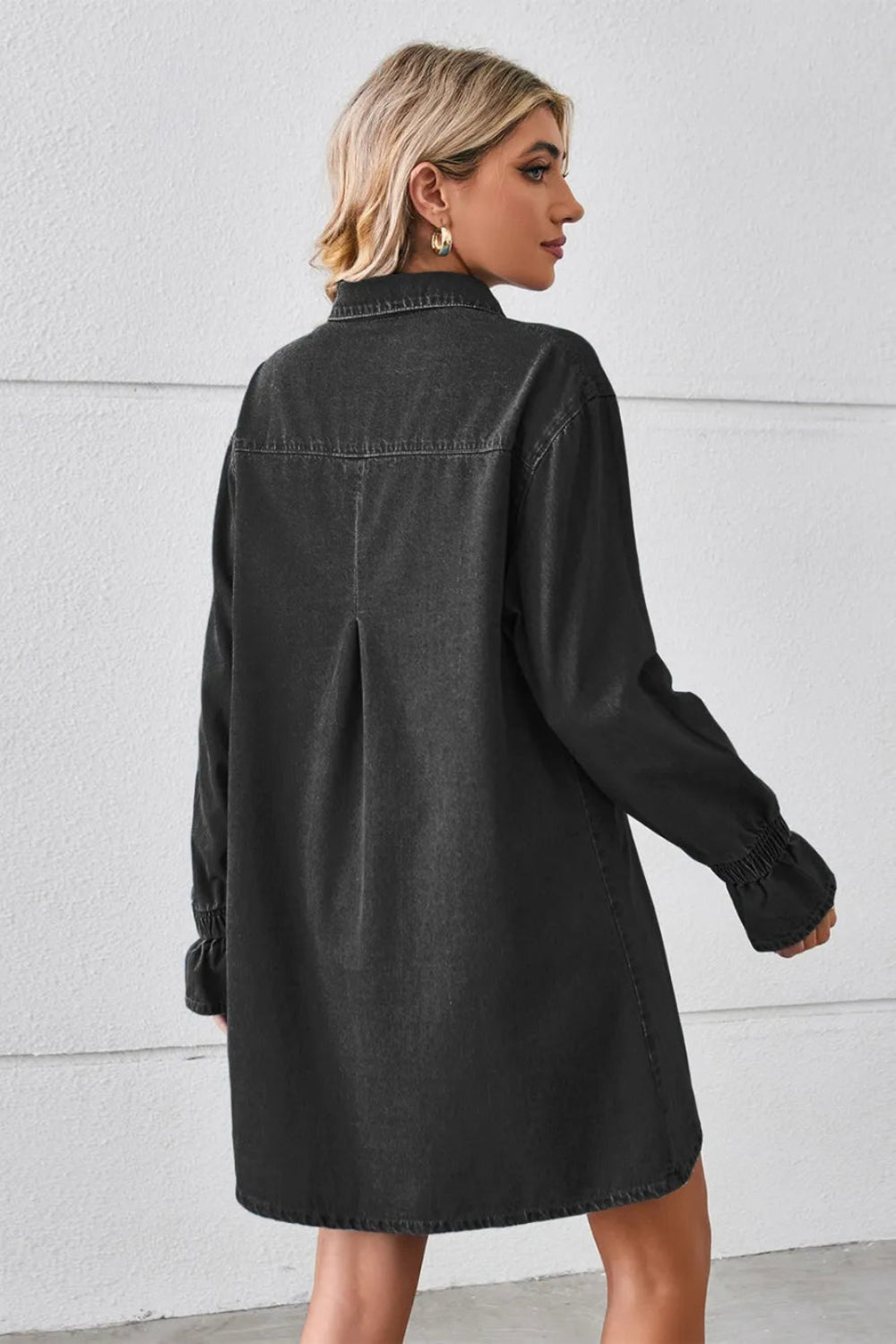 Shirt dress, mini, denim, drop shoulder, long sleeve, elastic ruffled cuffs, collared, front patch pockets, back pleat, no stretch, back view