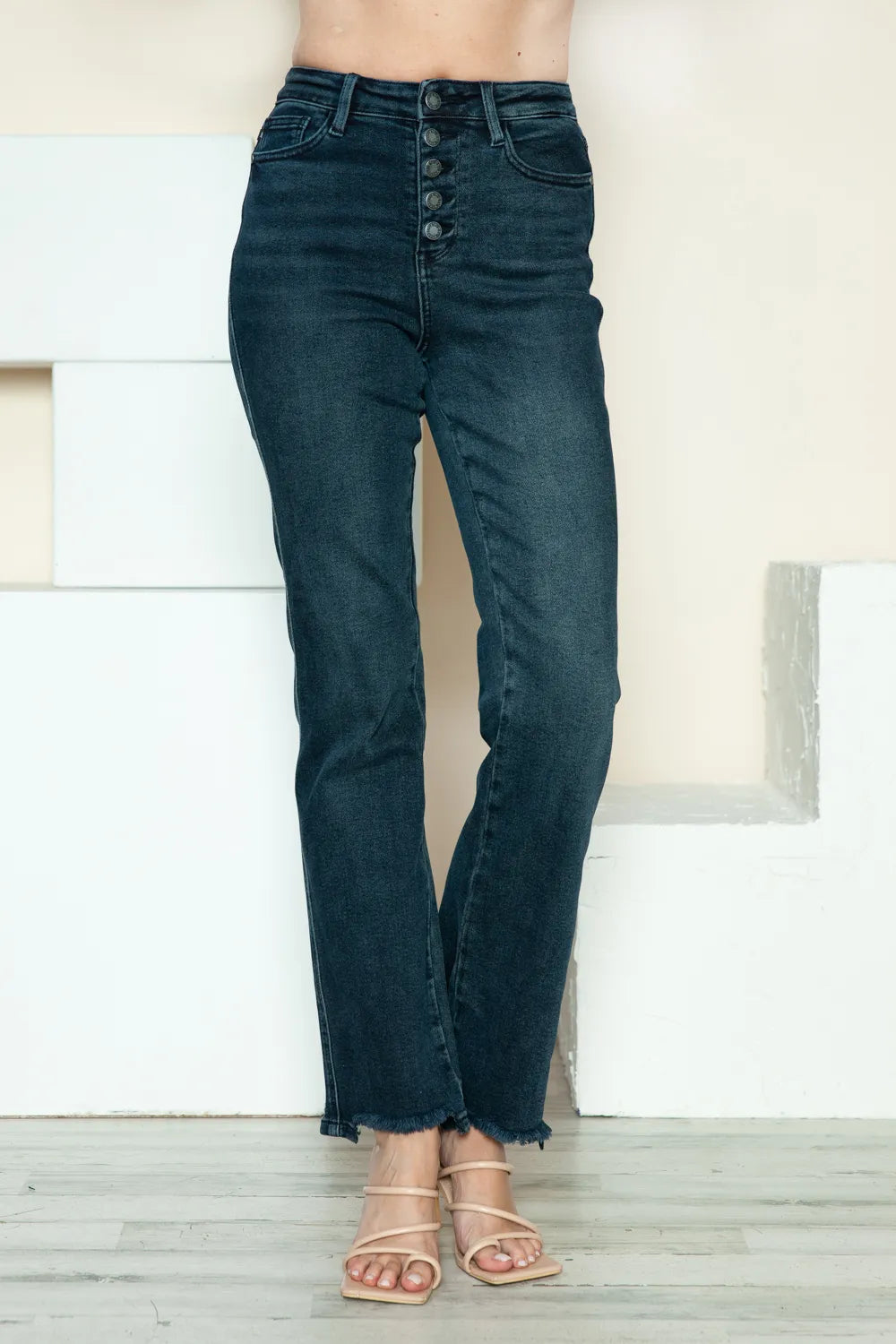Judy Blue Button Fly Straight Leg Jeans feature a dark wash, raw hem, stretch fit, and classic pockets front view
