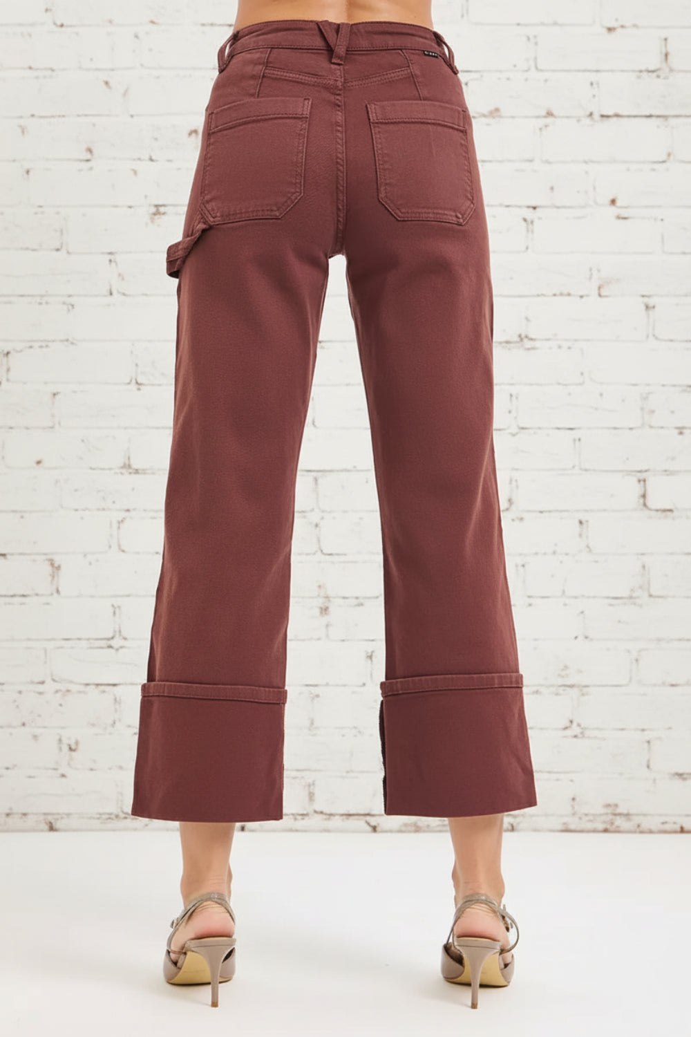 Risen jeans, full-size, high-rise, carpenter, wide leg, relaxed fit, pocketed, button/zipper closure, belt loops, cuffed hem, slightly stretchy, back view