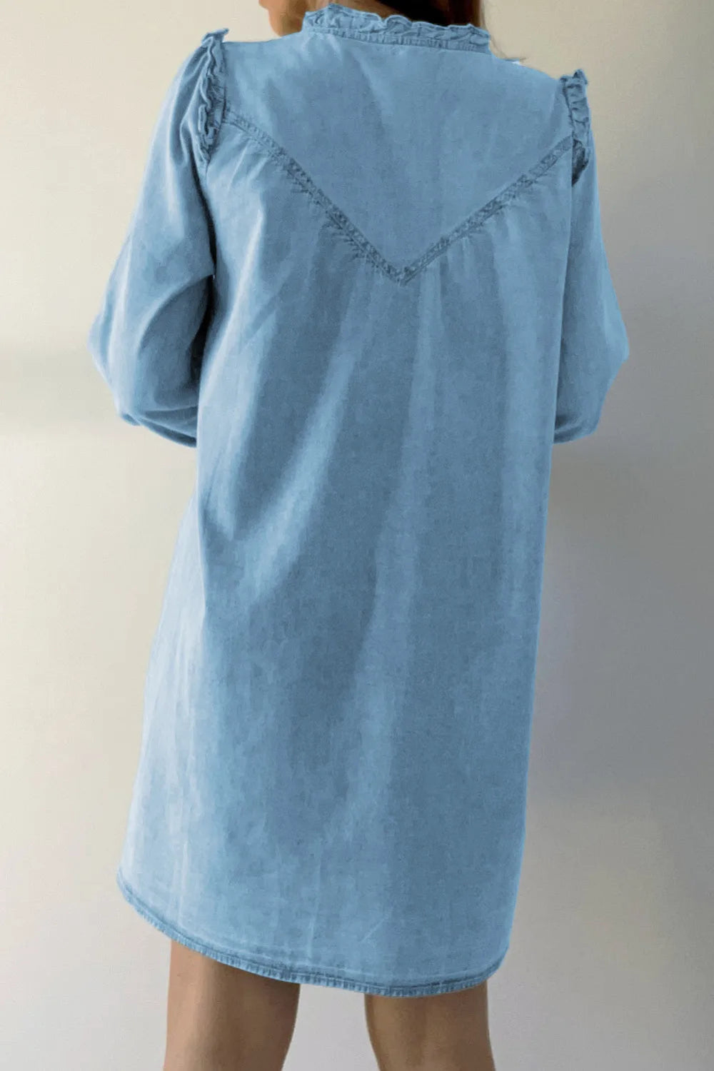 Denim mini dress, ruffled collar and shoulder, notched, long sleeve, button closure and cuff, pleated slightly front and back, no stretch back view