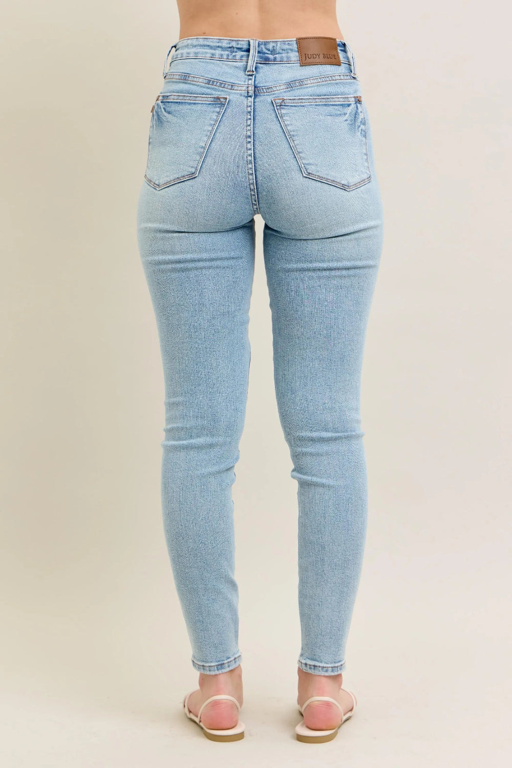 Judy Blue Jeans, full-size, mid-rise, 5-pocket design, light wash, button-zip closure, ankle length, slightly stretchy, back view