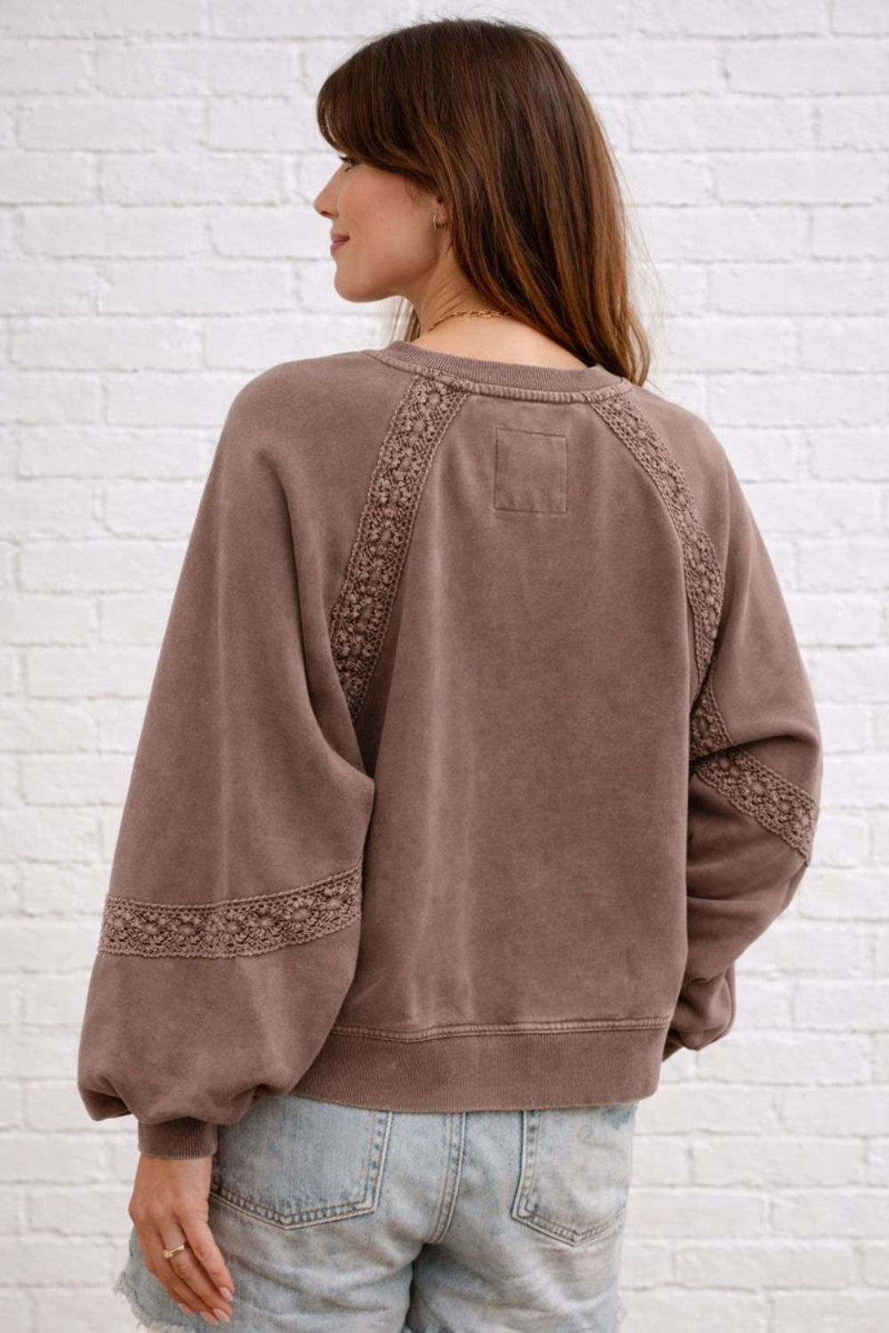 sweatshirt, washed, pullover, long sleeve, notched neck, raglan style, lace detail, oversized, slightly stretchy, back view