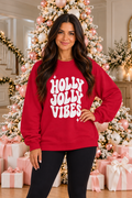 Holly Jolly Vibes Graphic Sweatshirt in Christmas red with bold white retro lettering, starburst accents, crew neckline, drop shoulders and long sleeves.
