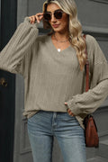 Top, v-neck, long sleeve, bishop sleeve, drop shoulder, ribbed, opaque, oversized, slightly stretchy, front view
