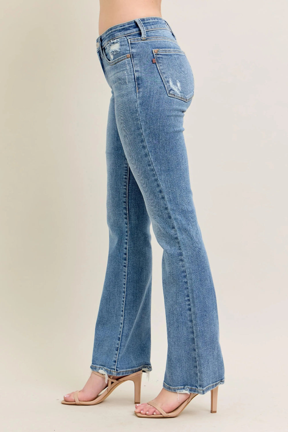Judy Blue Jeans, mid-rise, full-size, washed, pocketed, raw hem, bootcut, slightly stretchy side view
