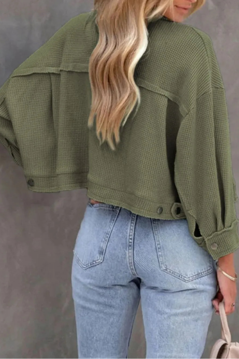 Jacket, collared, oversized, distressed, pleated, drop shoulder, buttoned, pocketed, long sleeve, waffle-knit, exposed seam, sits at the waist, pleated, adjustable straps, some stretch back view