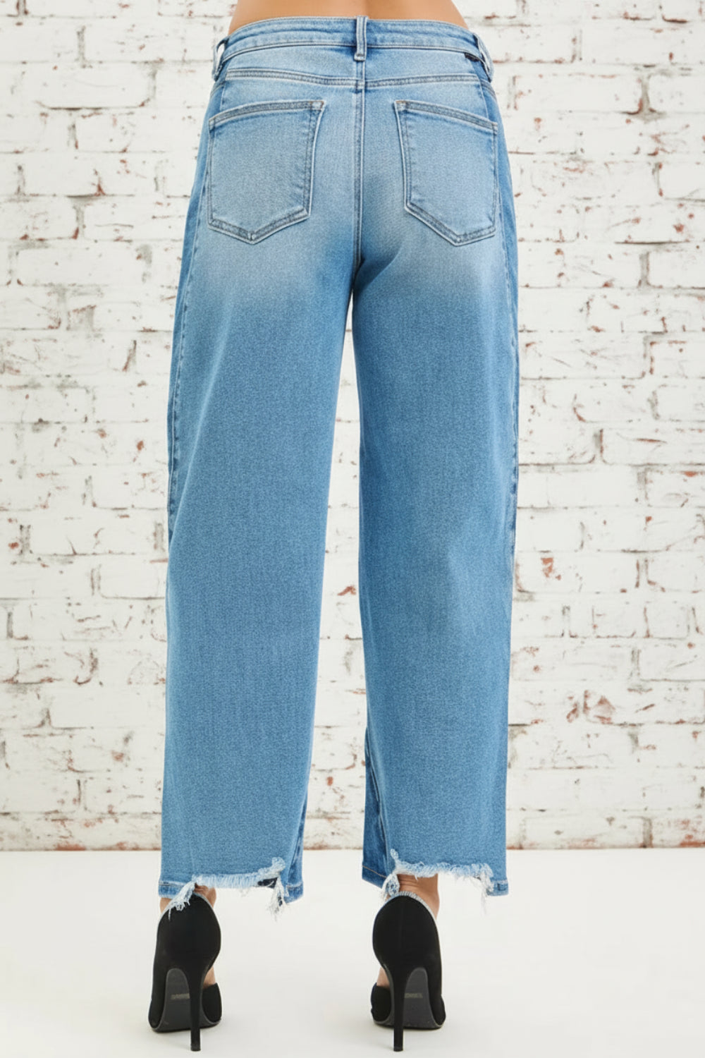 Risen Jeans, full-size, mid-rise, slouchy, cropped, barrel shape, dark combo, raw hem, belt loops, button/zipper closure, pocketed, slightly stretchy, back view