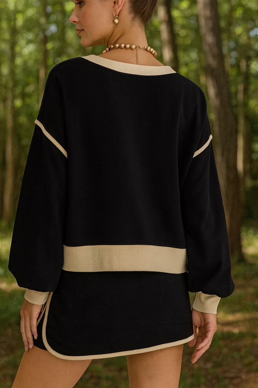 Two-piece skort set, round neck, pullover, drop shoulder, long sleeve, elastic waist, drawstring, pockets, contrast trim, slightly stretchy, back view