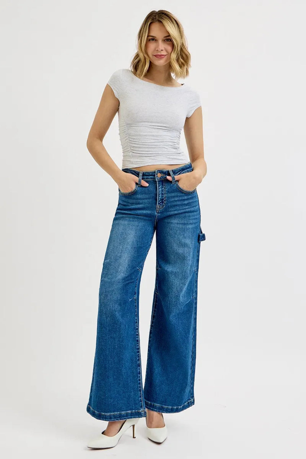 Risen Jeans, full-size, high-rise, darted, wide leg, one side hammer loop, pocketed, belt loops, button/zipper closure, washed, raw hem, slightly stretchy, front view

