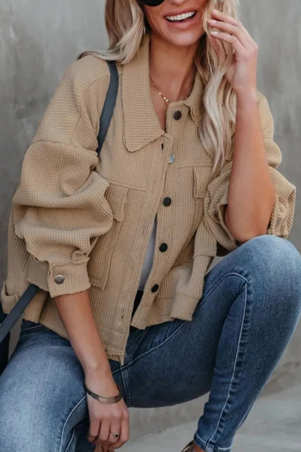 Jacket, collared, oversized, distressed, pleated, drop shoulder, buttoned, pocketed, long sleeve, waffle-knit, exposed seam, sits at the waist, pleated, adjustable straps, some stretch front view